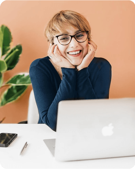 Instructor smiling at laptop